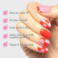 Close-up of Olive & June press-on nail pink checker pattern, showcasing realistic salon finish