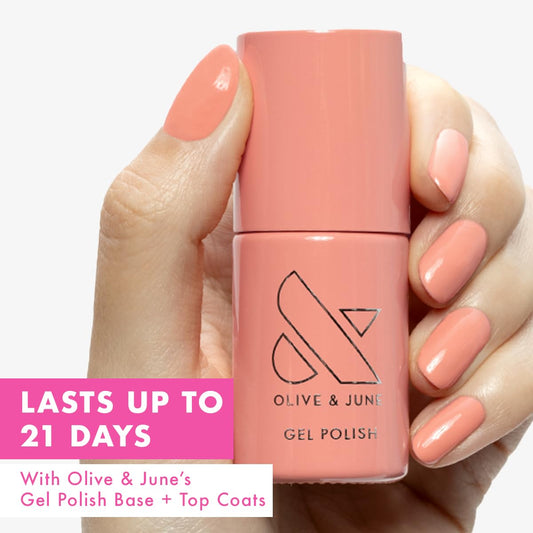 Olive & June CS Coral brush applying a smooth stroke for even coverage benefit