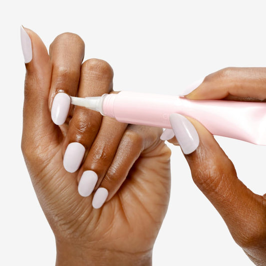 Olive & June brush-tip close-up demonstrating precise applicator for targeted hydration