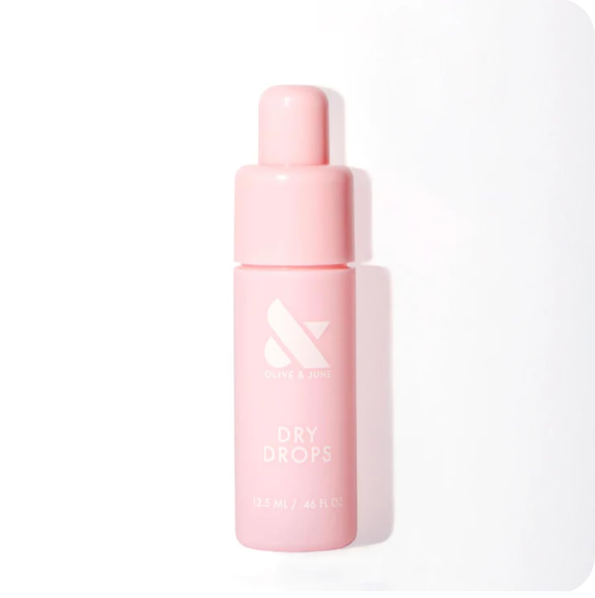 Olive & June Dry Drops front bottle showing compact design and brand