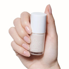 Olive & June front bottle of BEB Sheer White showing polish label and benefit