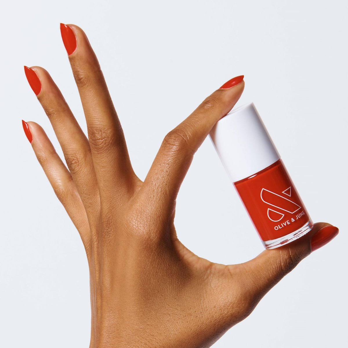 Olive & June front bottle CV Cherry Red showing glossy finish and salon look