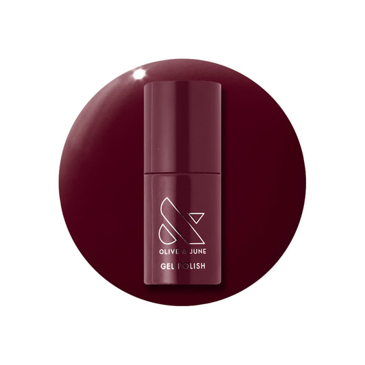 Olive & June bottle front view showing Obsessed Dark Ruby and glossy finish