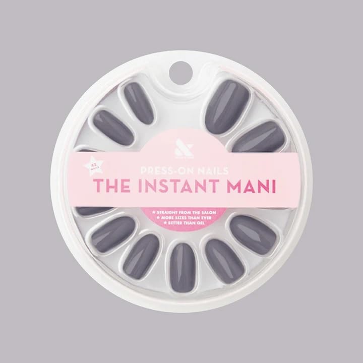 Olive & June front packaging showing full Instant Mani kit and tools, clear convenience benefit