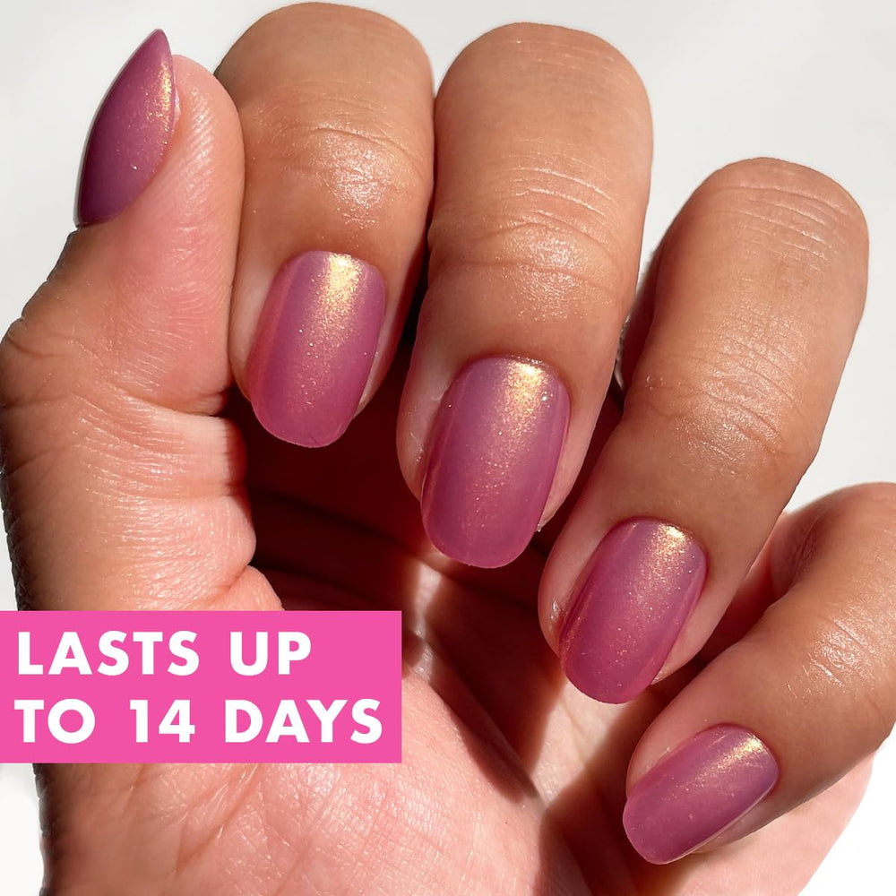 Olive & June hand model wearing Baby Starfish nails demonstrating polished finish