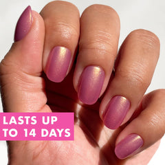 Olive & June hand model wearing Baby Starfish nails demonstrating polished finish