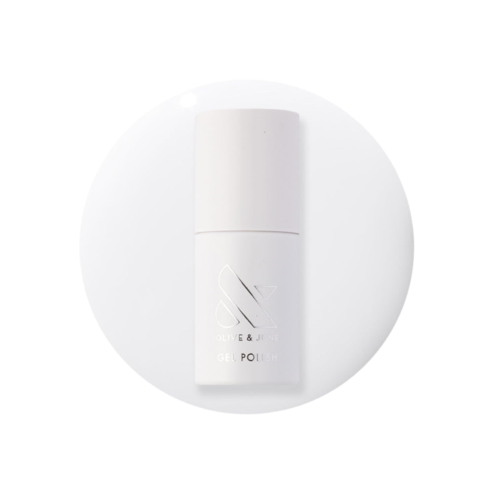 Olive & June bottle front packaging showing crisp white shade benefit