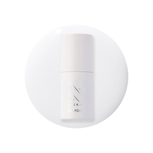 Olive & June bottle front packaging showing crisp white shade benefit