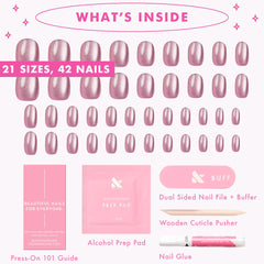 Olive & June styled hands wearing short round nails for everyday wear