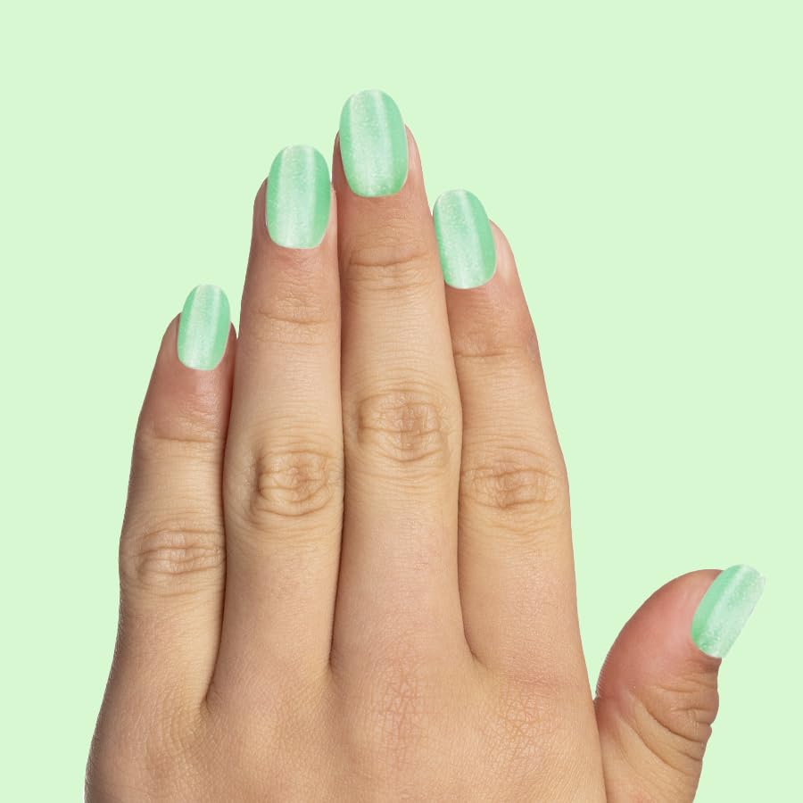 Child wearing Olive & June Grogu nails smiling, demonstrating easy wear