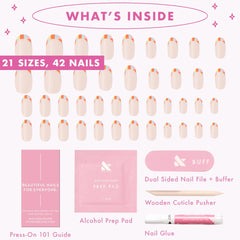 Olive & June nails on a hand beside a coin for size comparison benefit: clear scale and fit