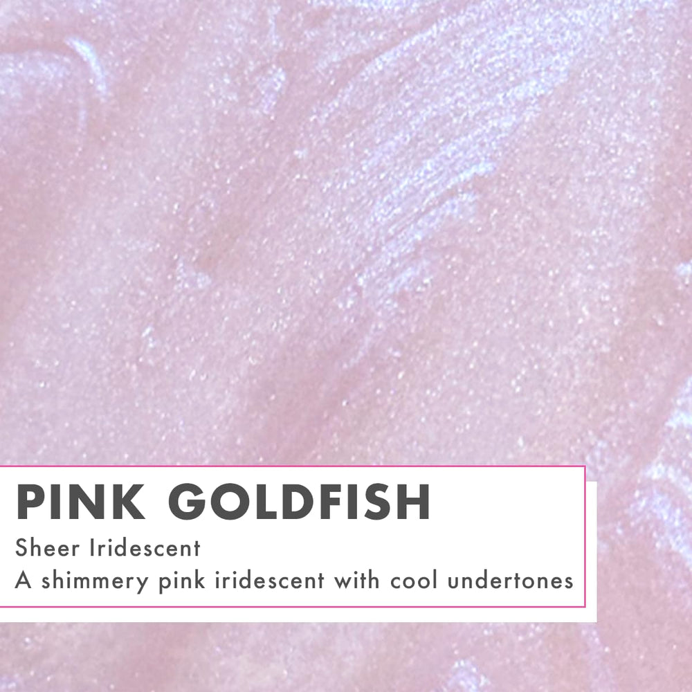 Olive & June swatch on forearm showing pink iridescent shimmer