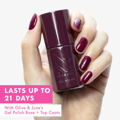 Olive & June swatch on fingernails displaying rich purple color and even coverage
