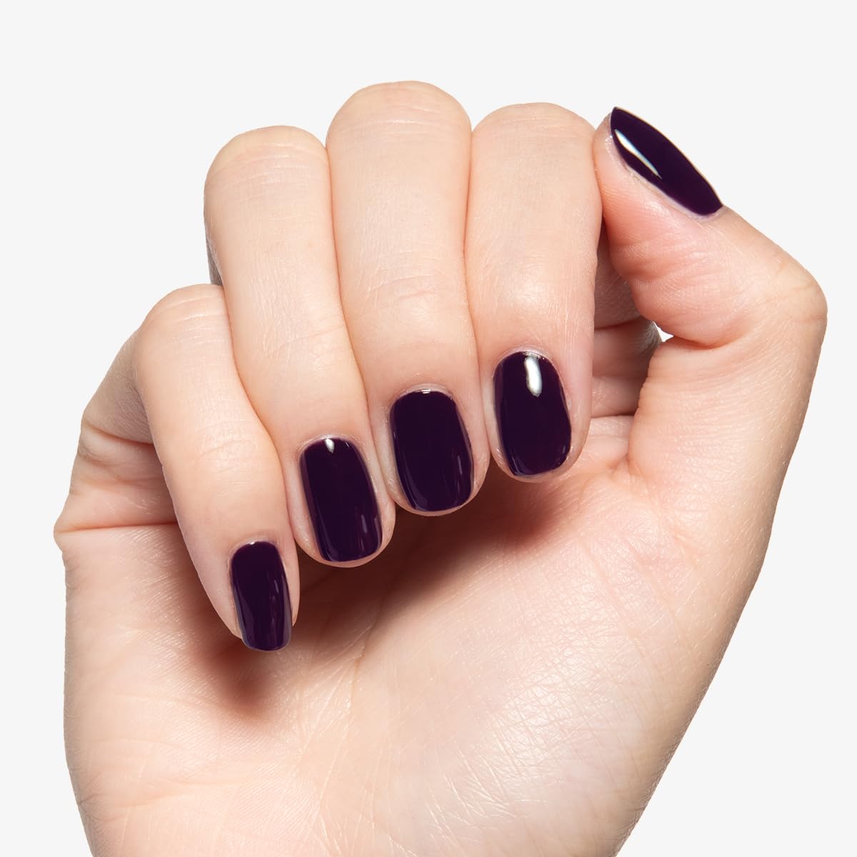 Olive & June manicure on fingertips in Plum Purple SD showing glossy salon finish