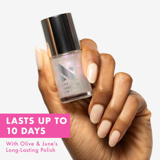 Olive & June brush spreading Sparkle Fairy polish evenly for quick coverage
