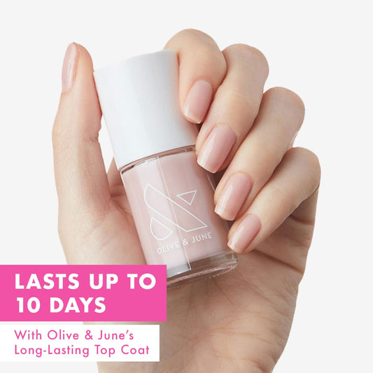 Olive & June wide brush fanning across nail for smoother application benefit