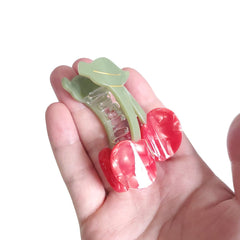 OMG Decor held in hand to show compact size and portability