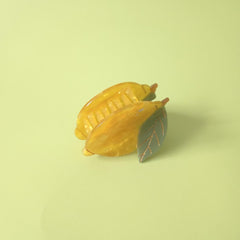 OMG Decor lemon claw clip in hair worn as half-up accent for everyday style