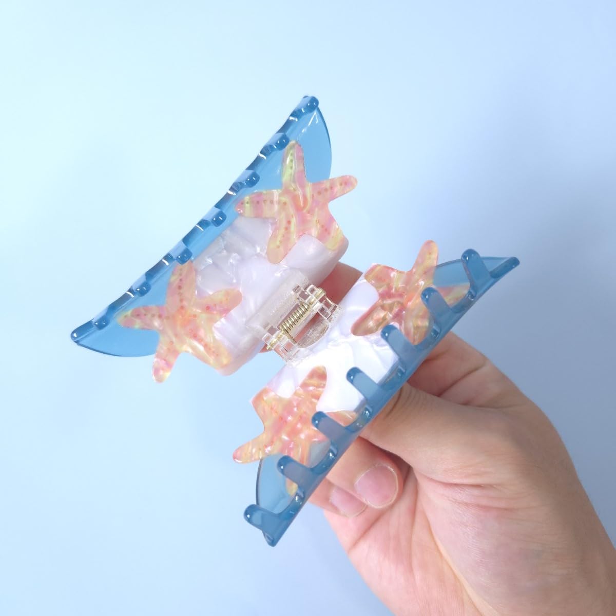 OMG Decor clip holding hair in a loose bun for hands-free convenience and neat look