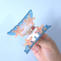 OMG Decor clip holding hair in a loose bun for hands-free convenience and neat look