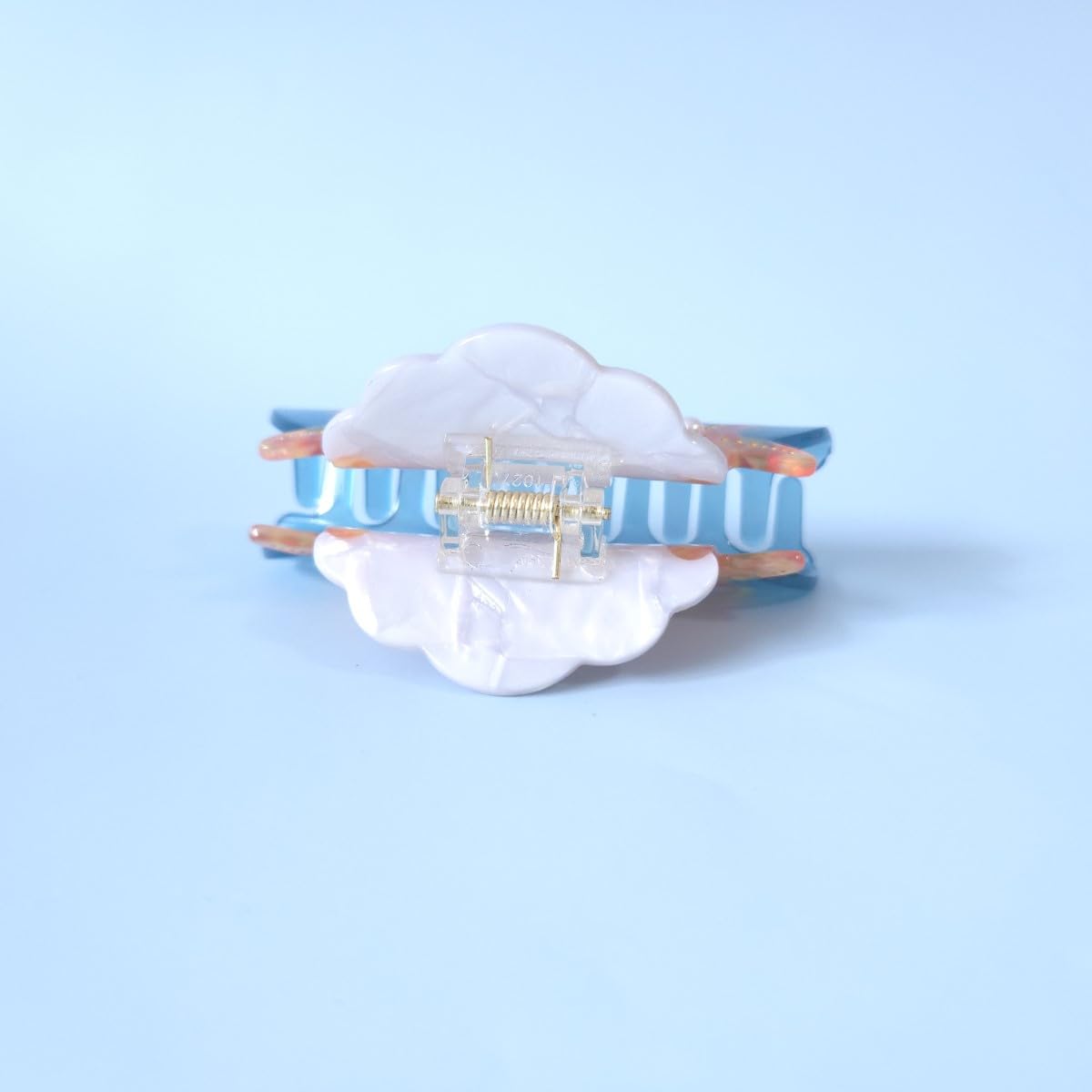 OMG Decor clip styled with beach outfit demonstrating coastal accessory for summer looks