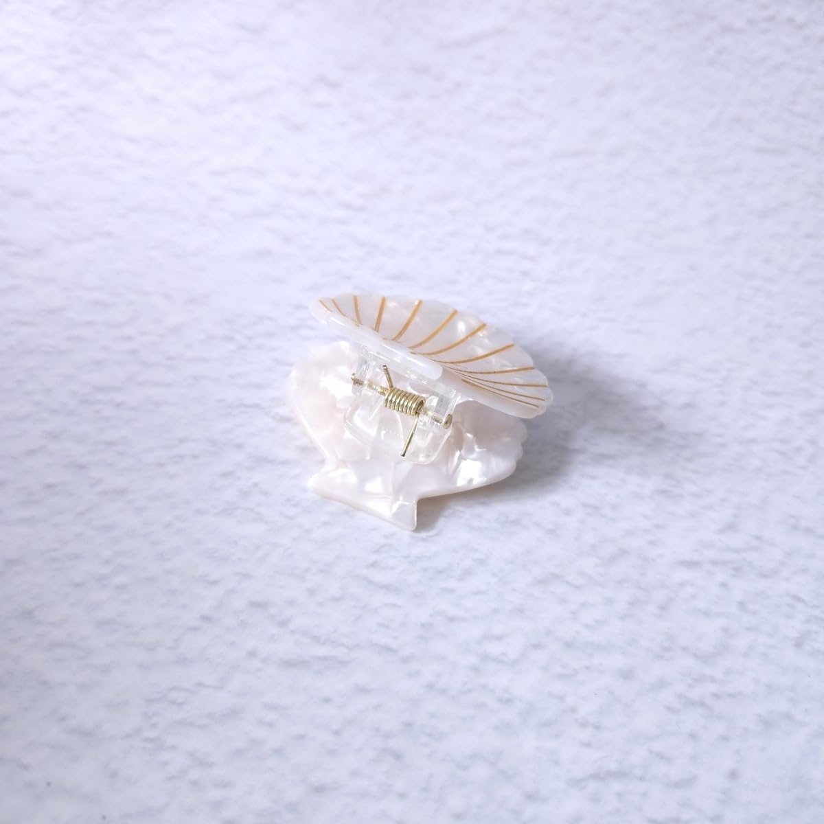 OMG Decor white shell claw clip worn in hair demonstrating tidy hold and style