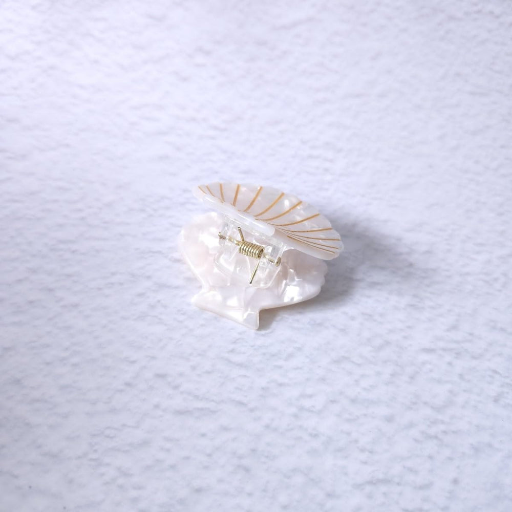 OMG Decor white shell claw clip worn in hair demonstrating tidy hold and style