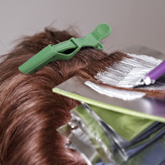 Ondder clips holding hair at a salon station demonstrating efficient sectioning