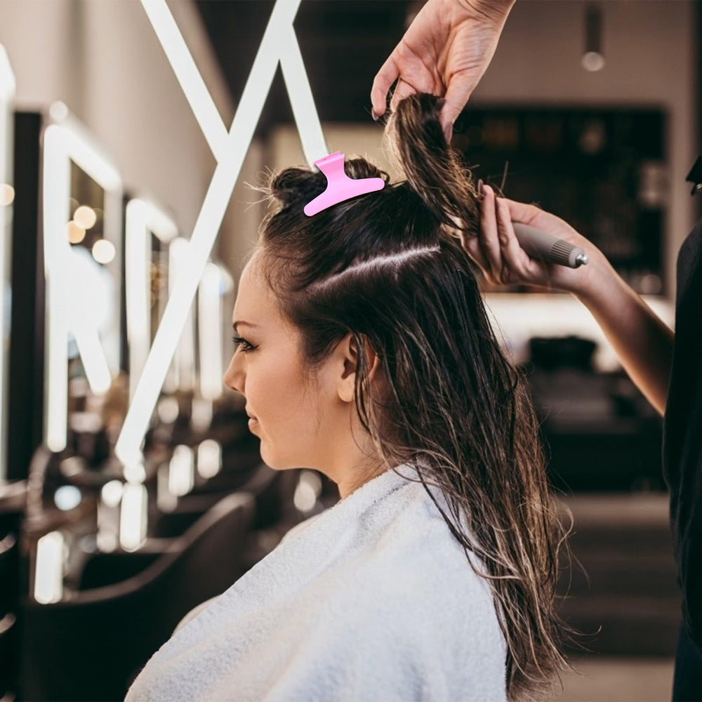 Ondder clip holding a hair section during a haircut for precision
