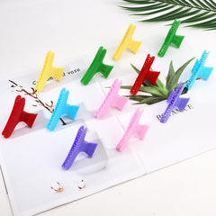 Ondder clips arranged in styling kit showing salon-ready organization benefit