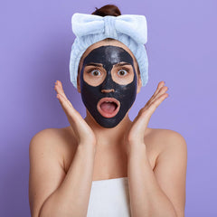 Ondder model washing face with headband keeping hair neatly back