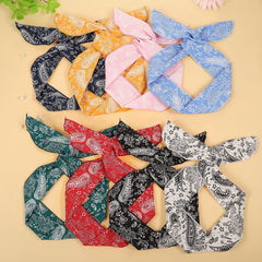 ONEYE laid flat bandana-style headband for neat hair hold