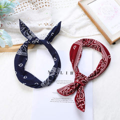ONEYE headband held in hand to show 31-inch length and flexible fit