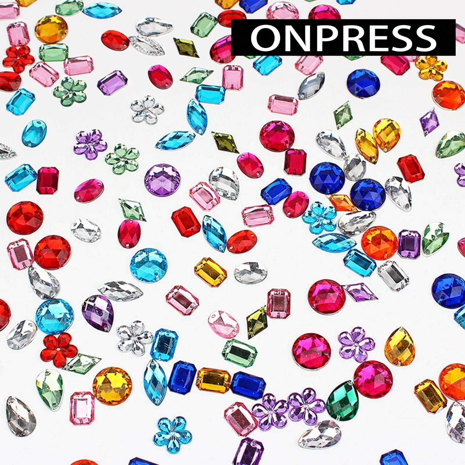 ONPRESS open compartment grid with 48 wells showing sorted colorful nail rhinestones