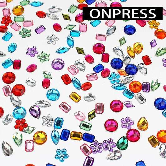 ONPRESS open compartment grid with 48 wells showing sorted colorful nail rhinestones
