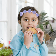Ooosonlu headband next to ruler and packaging showing compact size