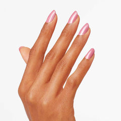 hand wearing OPI Aphrodite's Pink Nightie in lifestyle setting for subtle elegance