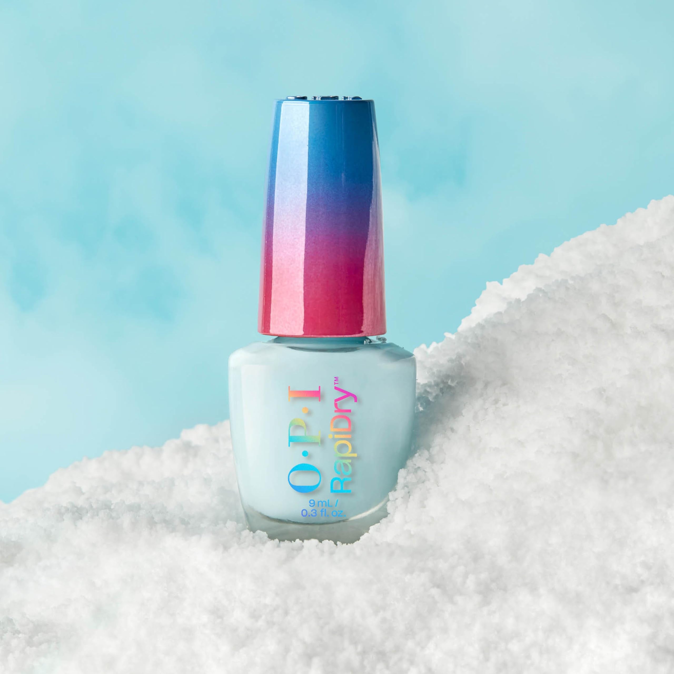OPI bottle next to coin size comparison showing compact travel-friendly bottle