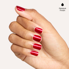 OPI Battle Red-y bottle in hand for scale and easy-at-home manicure advantage