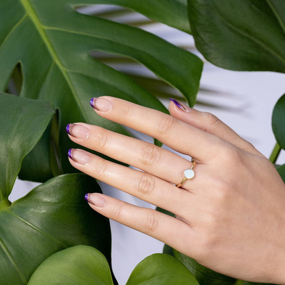 Hand model wearing OPI Bonfire Serenade in a relaxed lifestyle setting