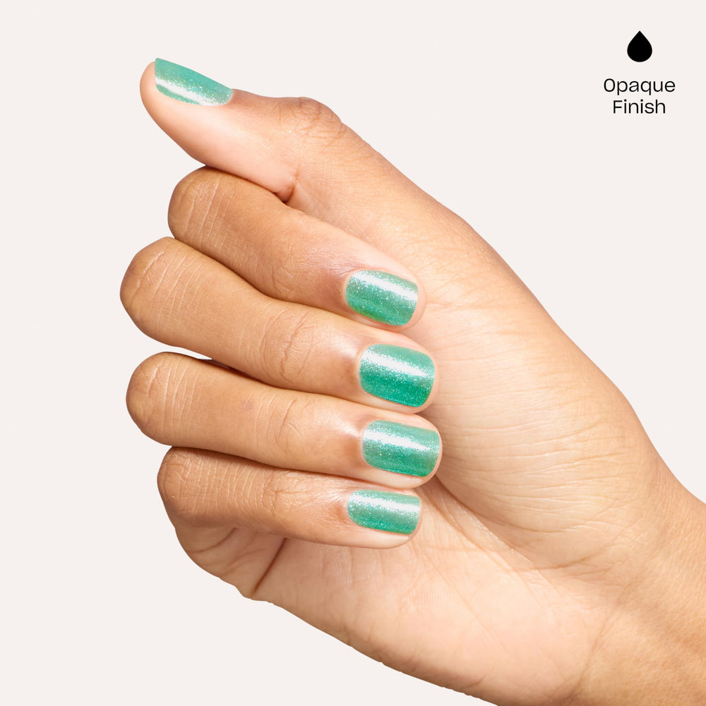 OPI bottle held in hand to show scale and easy‑to‑use size for home manicures