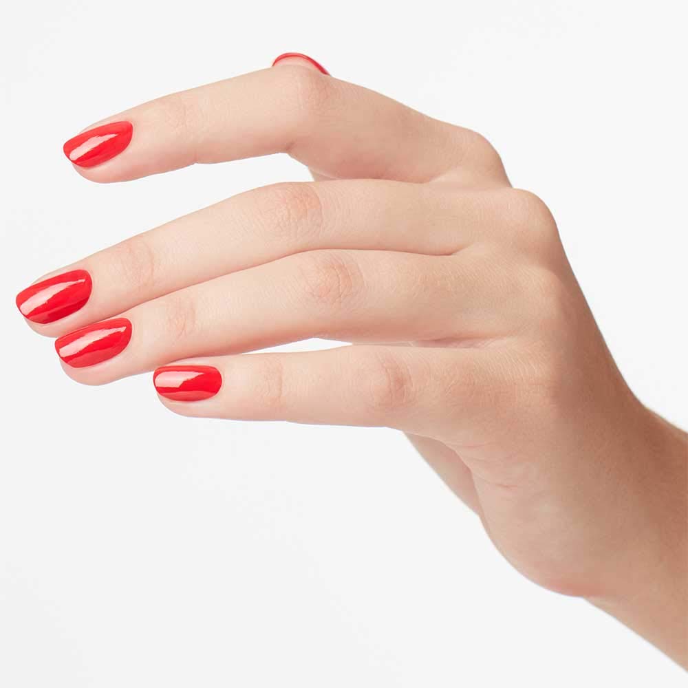 OPI painted nails on hands lifestyle shot showing flattering coral-orange benefit