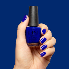 OPI brush applying polish to nail close-up demonstrating even strokes