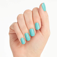 OPI polished nails wearing soft sea-blue shade, shows real-wear look