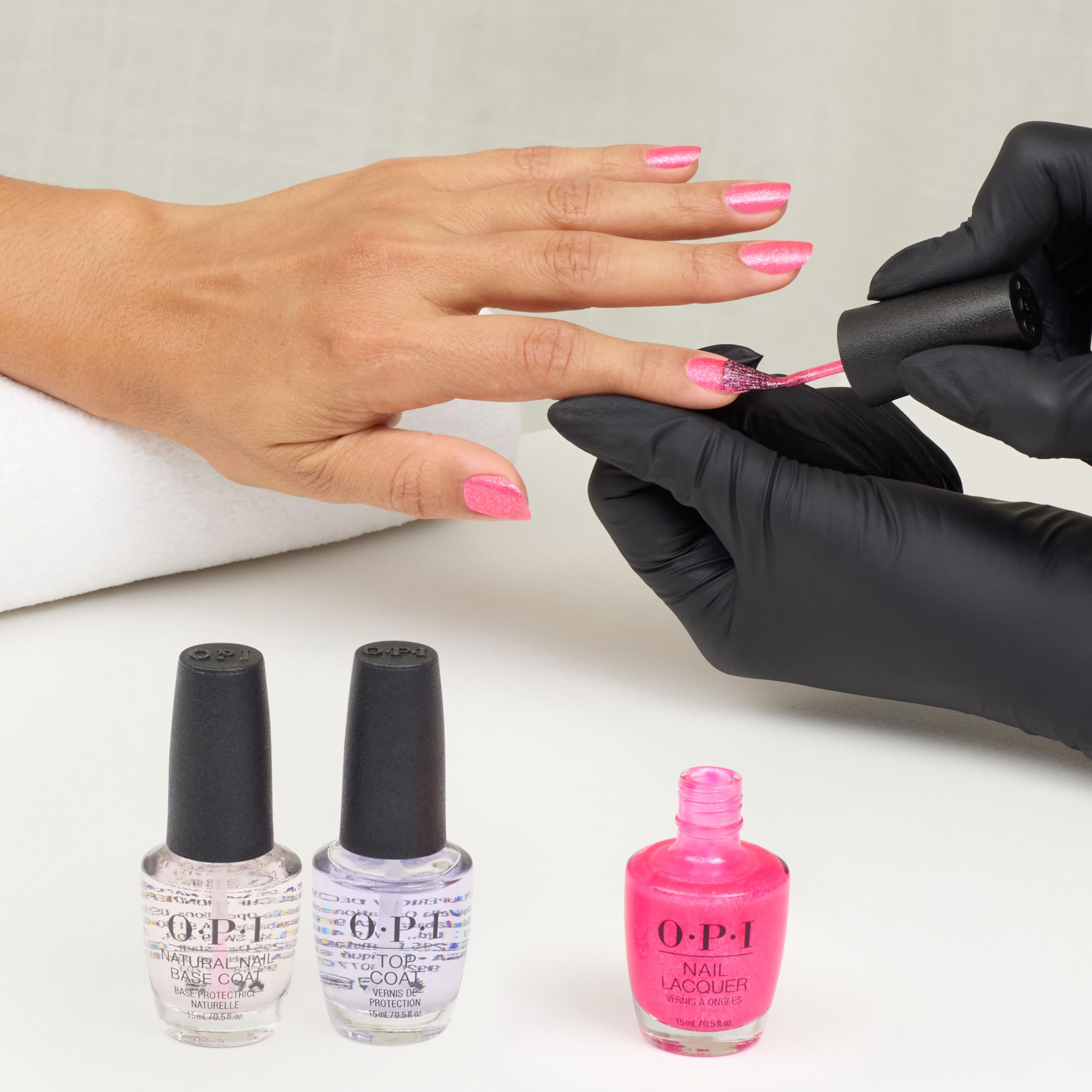OPI Dopa-mani next to coin for scale illustrating bottle size and portability