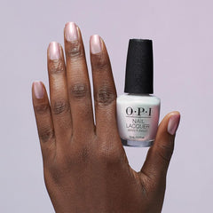 OPI layered over a dark polish creating luminous, multidimensional glow