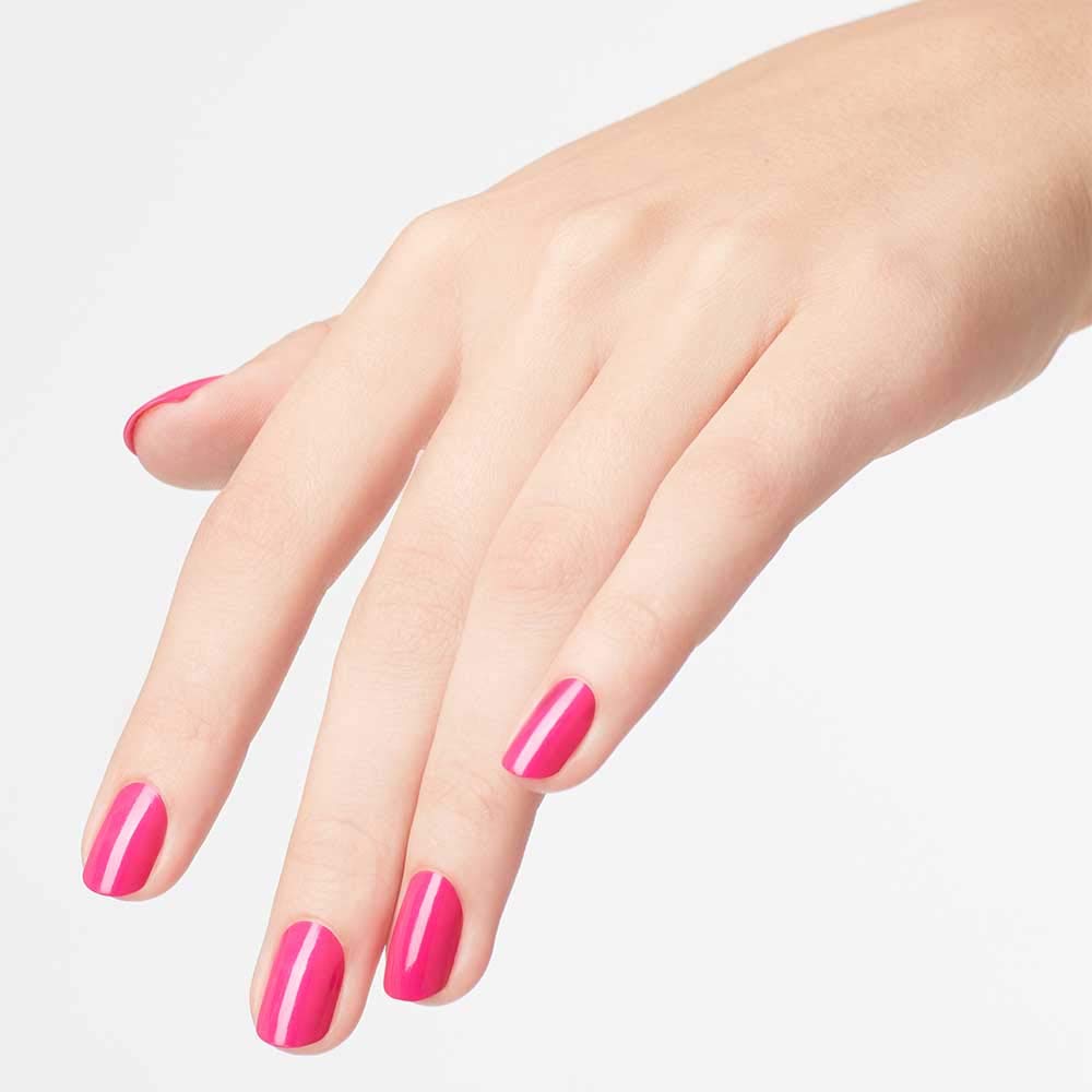 OPI bottle in hand for size scale and easy application benefit
