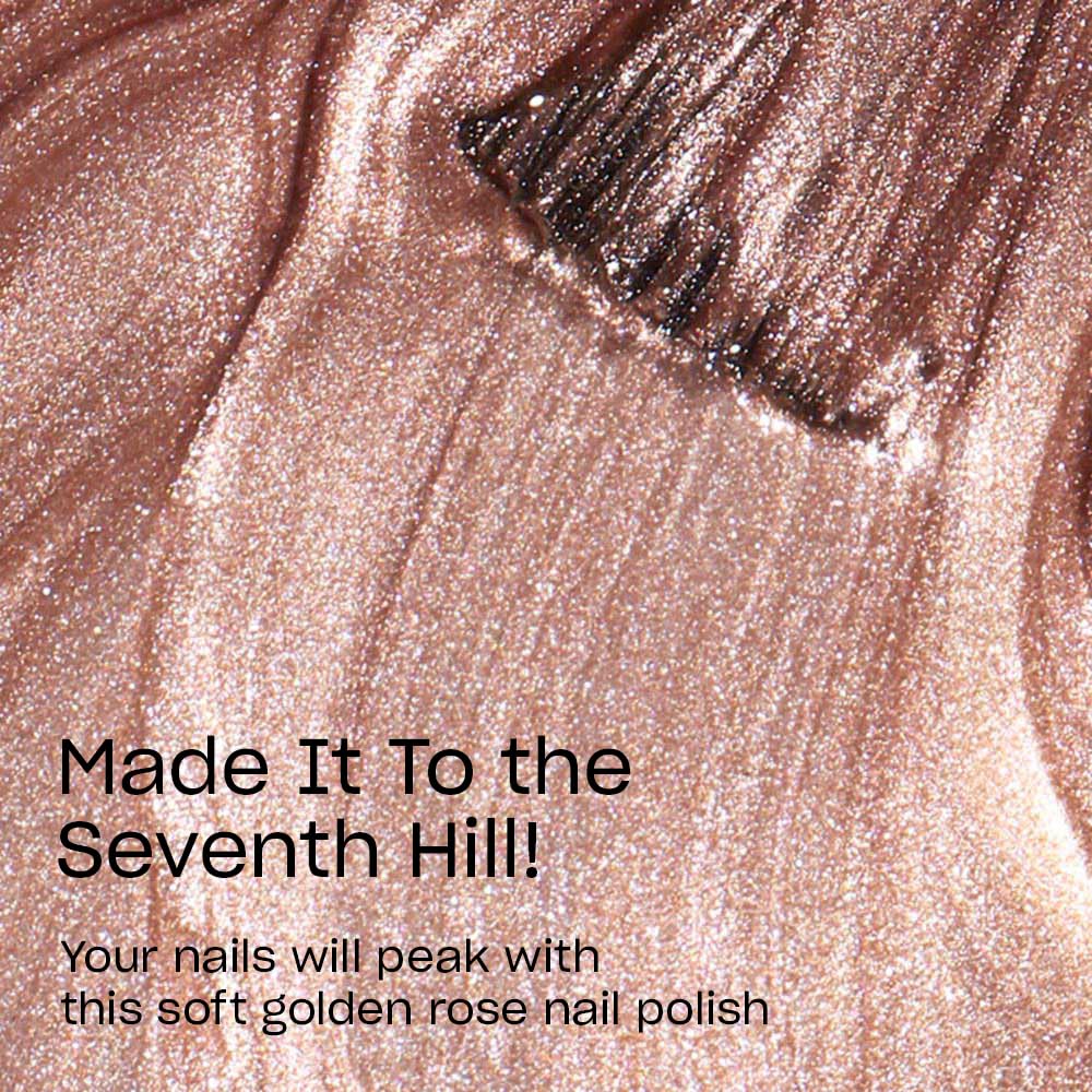 OPI color swatch on nail wheel showing sheer golden-rose shimmer and buildable opacity