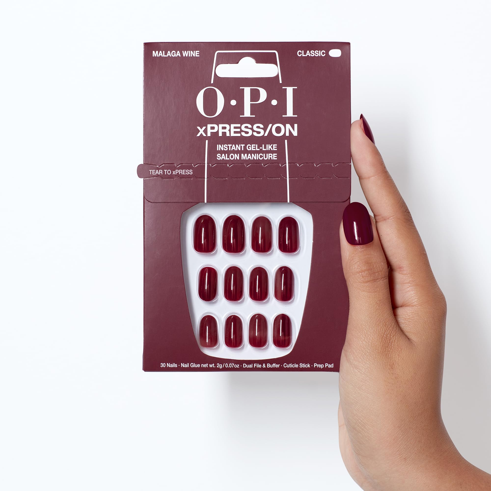 OPI lifestyle scene of Malaga Wine nails at evening event showing elegant style