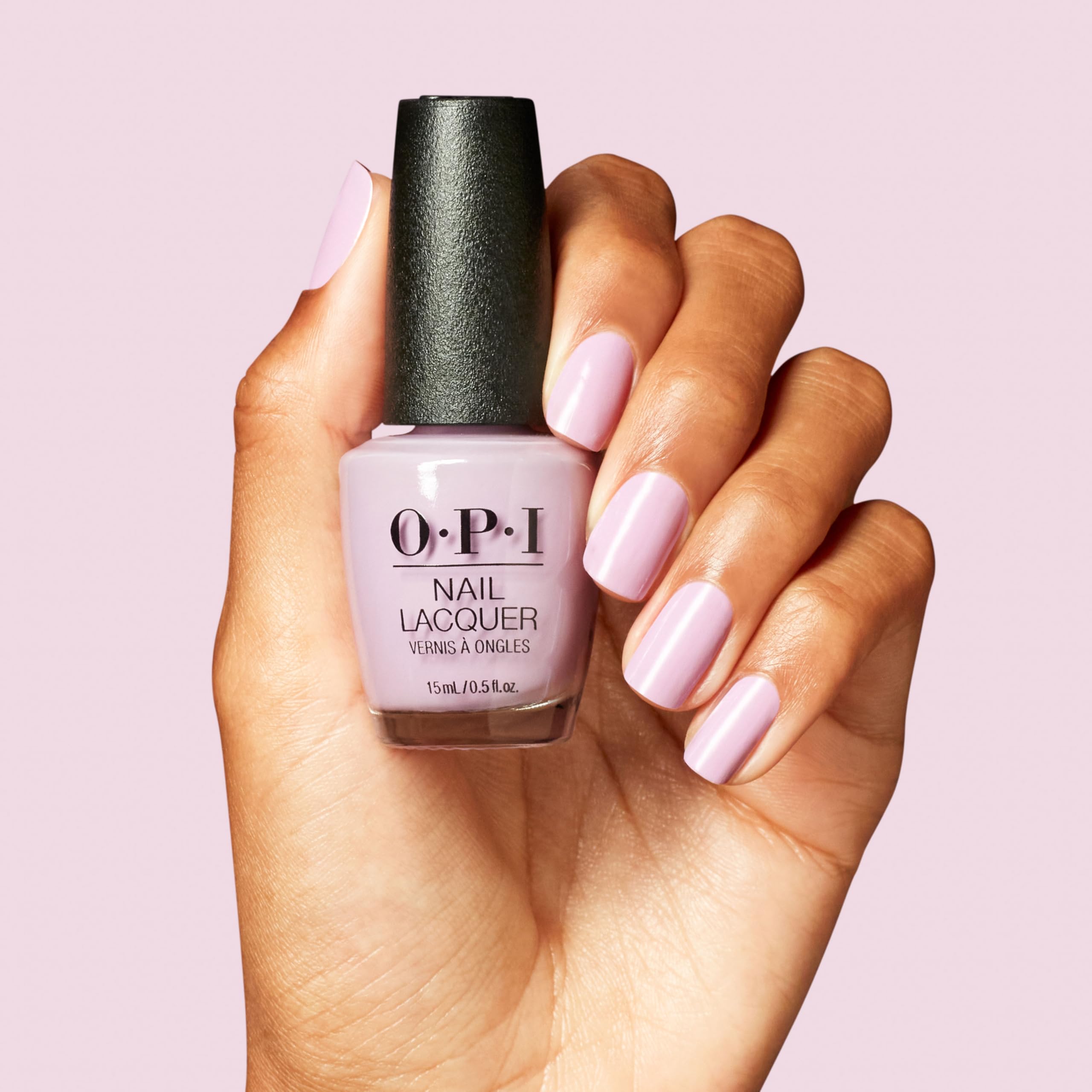 OPI application on hand using pro-wide brush for even, streak-free result benefit